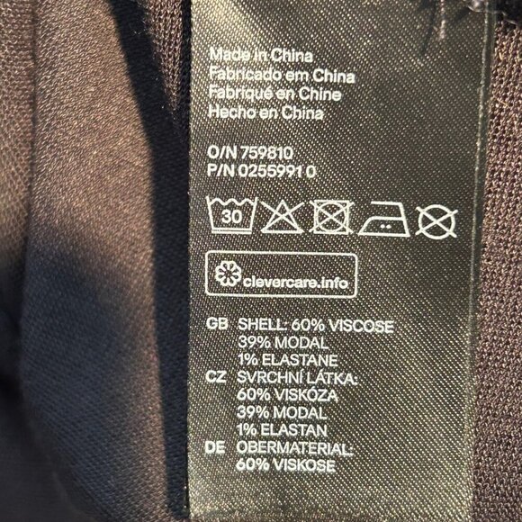 H&M Black Peplum Dress – Structured Fit, Soft Stretch Fabric, Layered Hem, Back - Picture 4 of 6